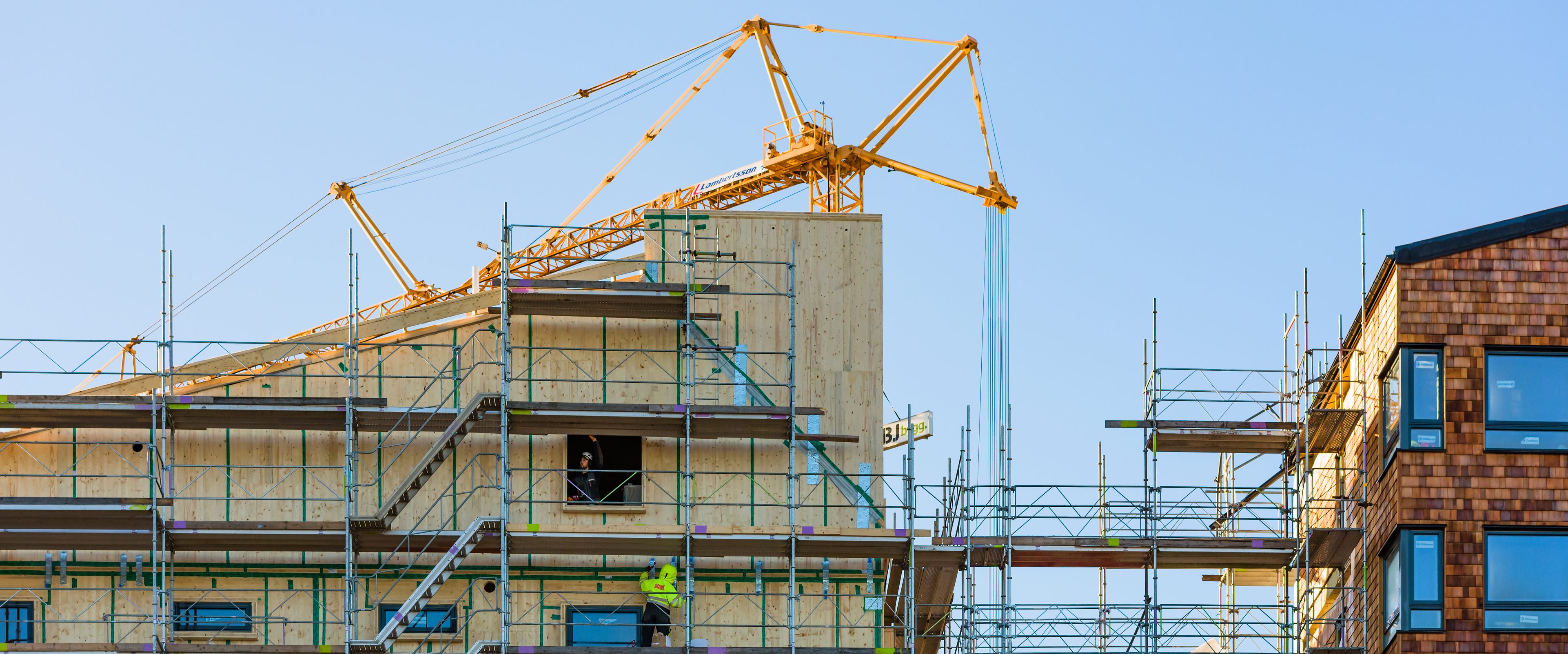 Workers at scaffoldings